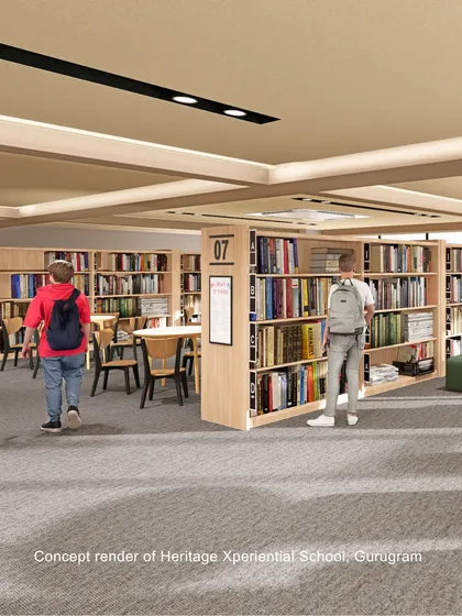 A concept render of the library at Heritage Xperiential School, Gurugram. The design uses standard bookshelves to create aisles and zones for focused study, demonstrating a more traditional yet effective library layout.