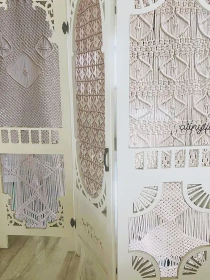 A closer look at the different macramé patterns woven into the custom room divider. Each panel was designed to be unique yet cohesive, adding texture and a vintage-modern feel to the space.