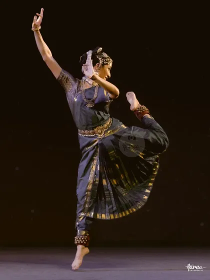 This is a physically demanding pose that requires immense strength and control. It showcases the athletic side of Kuchipudi dance.