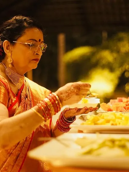 A guest enjoying a plate of fresh fruits from the buffet. Offering healthy and refreshing options is an important part of my catering service.