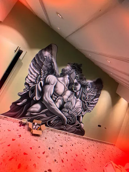 Another view of the finished angelic mural. The detail in the wings and the soft shading on the figures give the piece a sense of movement and emotion.