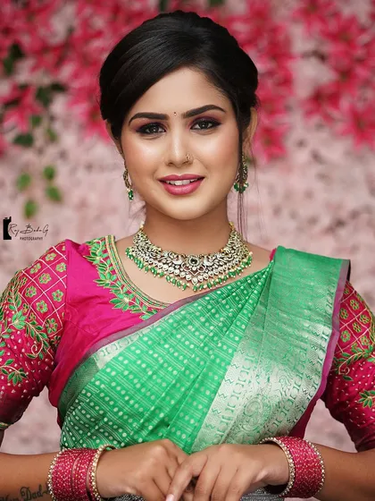 A full portrait of the model from my makeup class, showcasing the vibrant saree and complementary makeup.
