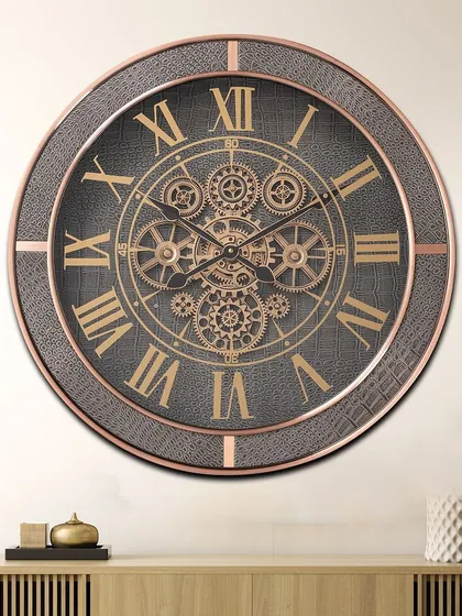A timeless masterpiece, this large wall clock features a grey leather-textured frame with rose gold accents. The exposed moving gears and classic Roman numerals make it a luxurious and bold statement piece.