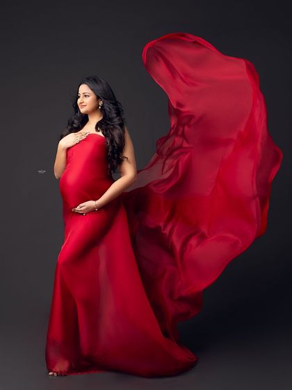 This shot captures the fabric in mid-air, creating a sense of energy and life. Mastering the fabric toss is a skill that will elevate your maternity photography.