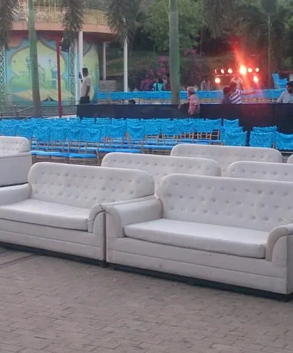The seating arrangement for the grand Sangeet in Lonavala, with plush white sofas for VIP guests and neatly arranged chairs for everyone else. We ensure comfortable and ample seating for events of all sizes.