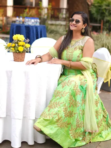A candid shot from the Haldi event, seated by the pool area.