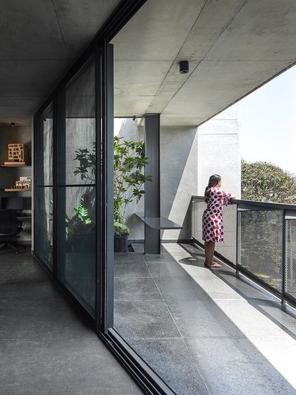 The balcony of our studio offers a connection to the outdoors and a space for our team to take a break. The design uses simple, durable materials like concrete and steel mesh to create a functional and minimalist outdoor area.