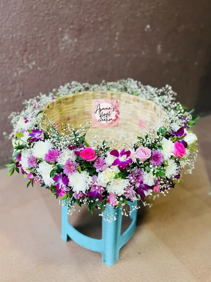 An empty view of the 'Jawal' ceremony basket, showing the intricate floral border I create around the rim.