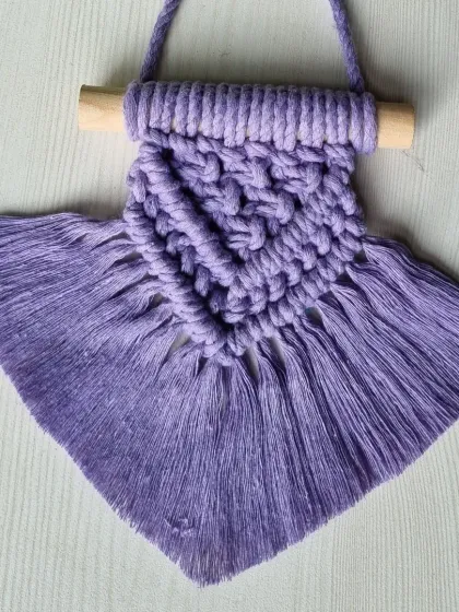 This small lavender wall hanging is a great first project for anyone new to macrame. In my workshops, I break down the process so you can create your own stunning piece, even if you've never tied a knot before.
