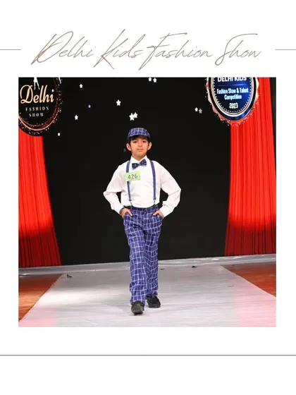 This young model looks sharp and confident in his classic formal wear, complete with a bow tie and suspenders. My shows give boys a chance to showcase their dapper side on a professional ramp.