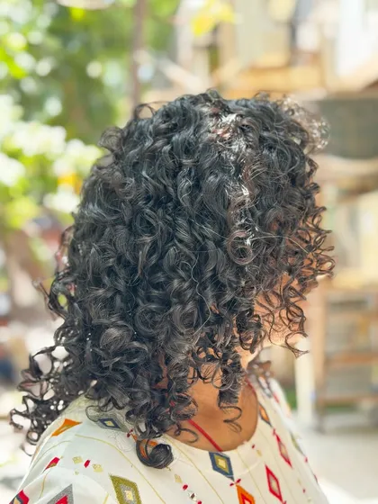 More examples of my short curly haircuts, from bobs to layered chops, each one personalized to the client's curl pattern and face shape.