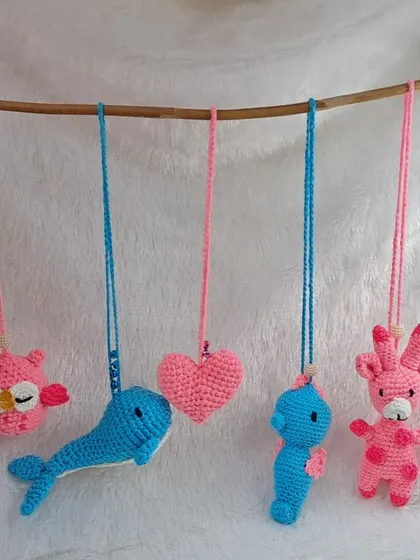 A collection of my various hanging ornaments, featuring an owl, whale, heart, seahorse, and giraffe. Each one is a small, handmade treasure.