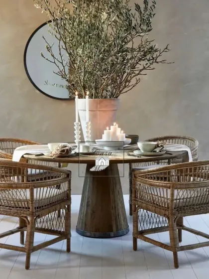 We created this elegant dining set to bring a touch of rustic sophistication to mealtimes. The round wooden table is surrounded by our sturdy, comfortable rattan dining chairs, perfect for both intimate family dinners and stylish entertaining in a modern home.