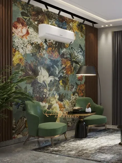 The statement floral wallpaper is the hero of this space, complemented by deep green velvet chairs and a modern arc lamp.