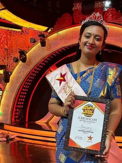 A proud moment for me, holding my winner's certificate on the sets of Suvarna Super Star. This recognition fuels my passion for bringing authentic, homemade food to more people.