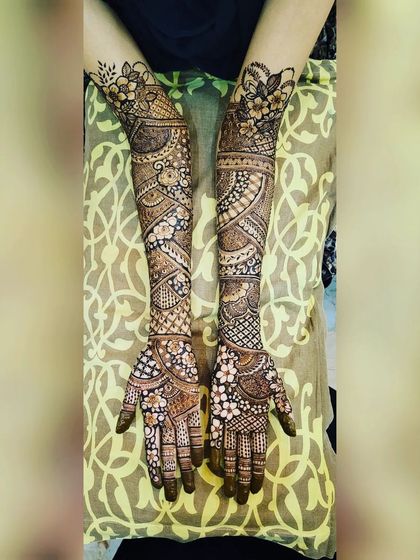 A beautiful, symmetrical full-arm design. I love creating patterns that mirror each other on both hands while still having unique elements.