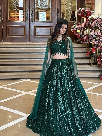 Another beautiful shot of the emerald green lehenga, perfect for a bride or bridesmaid who wants to stand out.