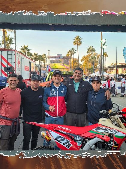Our team posing with the race-ready Honda CRF450X at the Baja 1000 starting line. This is the calm before the storm of a 1000-mile race.