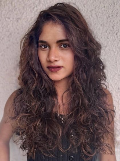 A portrait of the mocha-toned curly hair, showcasing the soft, defined curls and the beautiful color blend.