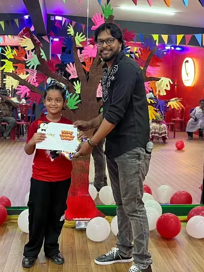 That smile says it all! The grand finale ends with every child receiving a certificate of appreciation. It's a proud moment for them and their parents, celebrating their hard work and participation.