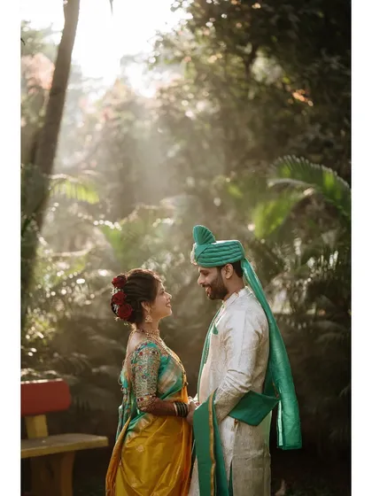 The magical forest light creates a halo around the couple. This portrait is a perfect example of how we blend nature and romance to create breathtaking images.