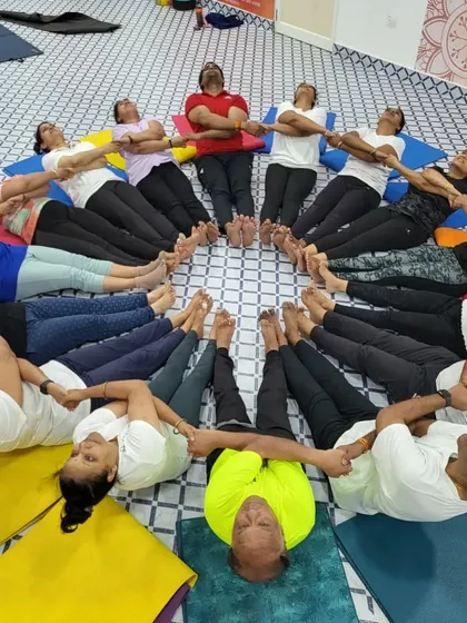 A partner boat pose circle, symbolizing our interconnectedness and mutual support. We hold each other up, both literally and figuratively.