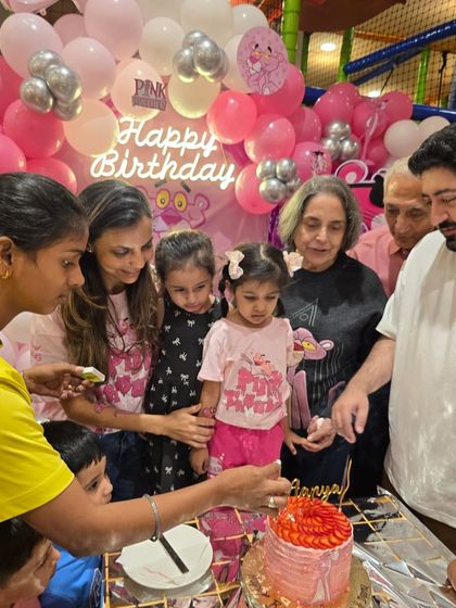 The cake-cutting moment at Aanya's Pink Panther party. I'm so honored to have my cake be a part of these precious family milestones.