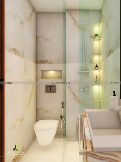 This was for one of our smallest projects, a toilet renovation in CR Park. The design uses light-colored marble-look tiles and built-in, lit niches to make the small space feel brighter and more spacious.