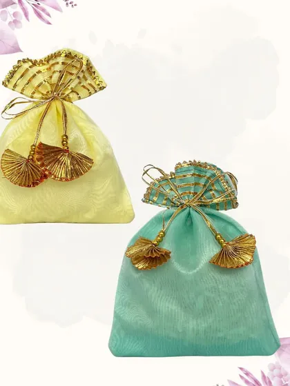 Simple yet elegant, these pastel-colored organza potlis are perfect as Mehendi favors or for bridesmaids. The delicate tassels and shimmering fabric give them a light and airy feel.