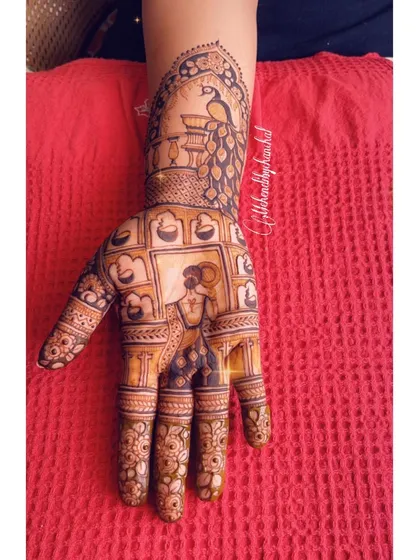A single hand from a Karwa Chauth set, showing a woman in traditional attire with diyas, celebrating the festival of lights and love.