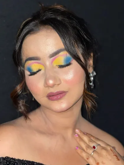 A close-up of the artistic eye makeup, highlighting the precise application and vibrant pigments.