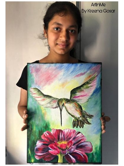 The proud artist with her hummingbird canvas painting. Her work is a testament to the realistic painting skills that can be developed in my classes.