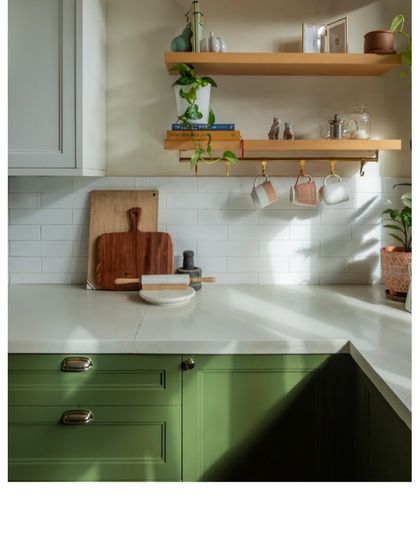 We believe kitchens should be bright and inspiring. Here, open wooden shelves and white subway tiles create a clean, fresh look, with sunlight streaming in.
