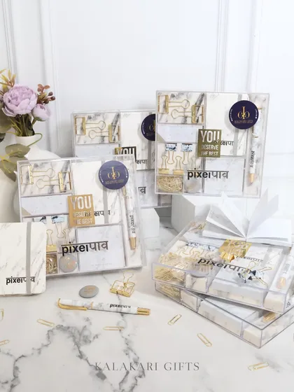 Another view of the bulk order of our "PixelPaav" stationery sets, some of which are wrapped with a white ribbon for gifting.