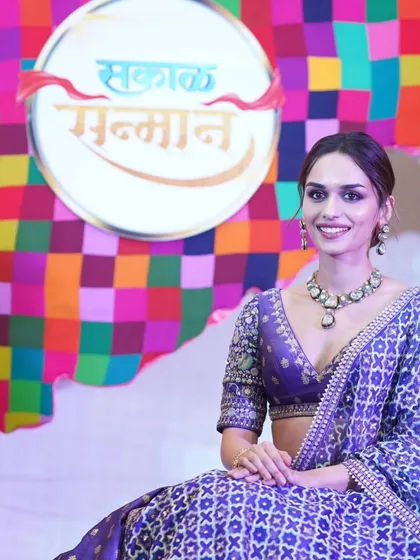 A posed photograph of actress Manushi Chhillar at the Sakal Sanman Awards. I provide professional red carpet and backdrop photography to highlight your event's branding and special guests.