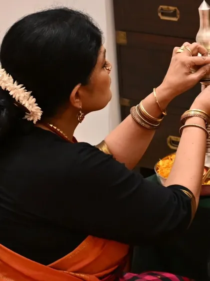 We begin every significant event with a prayer. Here, I am lighting the lamp to commence the Gejjai Puja, a ceremony to bless the ghungroos and the dancer before her final arangetram rehearsal.