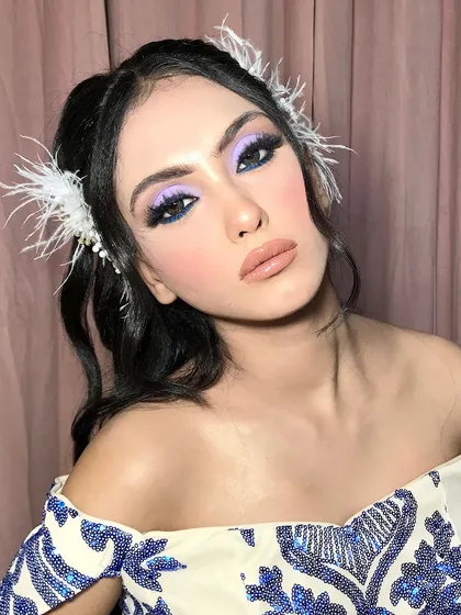 A final portrait, the client's "ocean eyes" makeup being the star of the show.