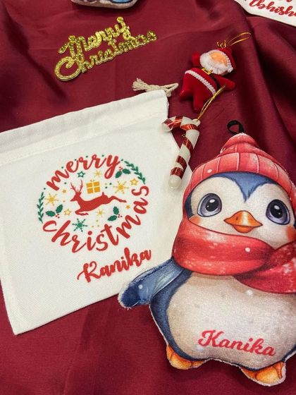 A cute personalised penguin plush ornament, perfect for adding a touch of winter wonderland to your Christmas tree.