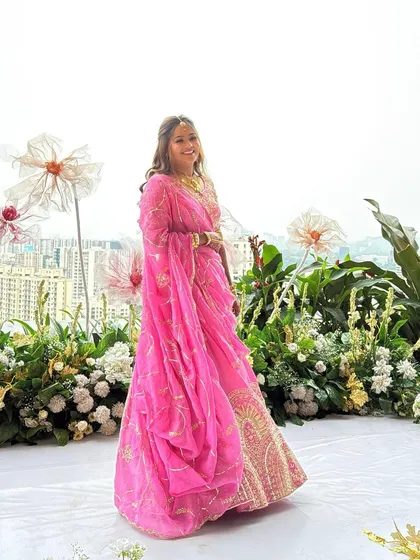 A joyful, twirling shot of the bride in her pink lehenga. The makeup is designed to last through all the moments of the day, from quiet portraits to energetic celebrations.