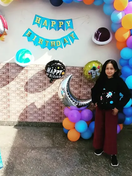 The birthday girl enjoying her outer space themed party. We love seeing the kids' happy faces when they see their dream party come to life.