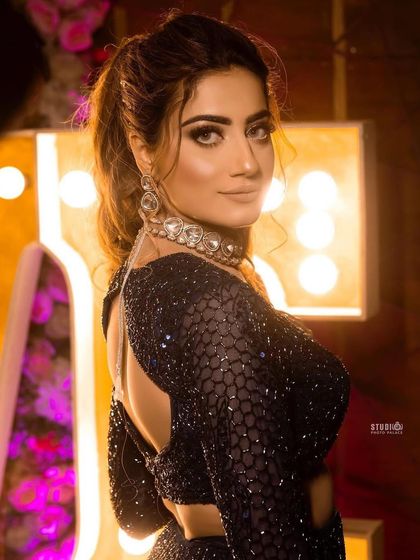 A backless blouse paired with our statement choker creates a bold and modern look.