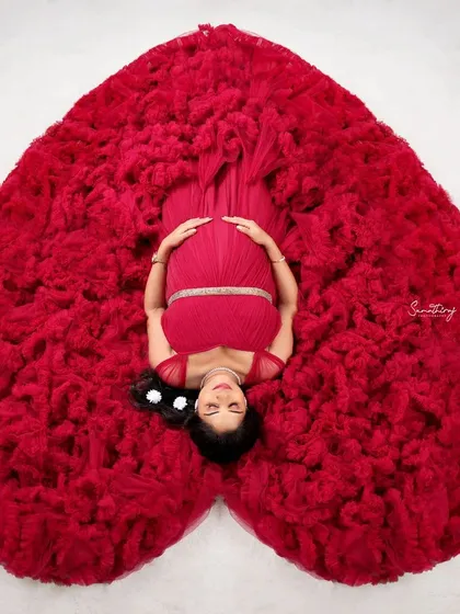 Your love story, beautifully framed. This popular heart-shaped gown pose is a creative and artistic way to celebrate your journey together. It's a client favorite and a shot I love crafting in my studio.