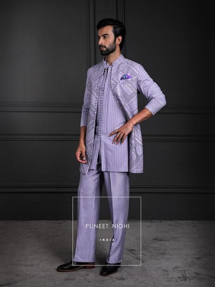 This is not fashion, but architecture in fabric. A kurta of graceful lines, a tunic held by loops, and bell-bottom textures that ground the silhouette in sculptural elegance.