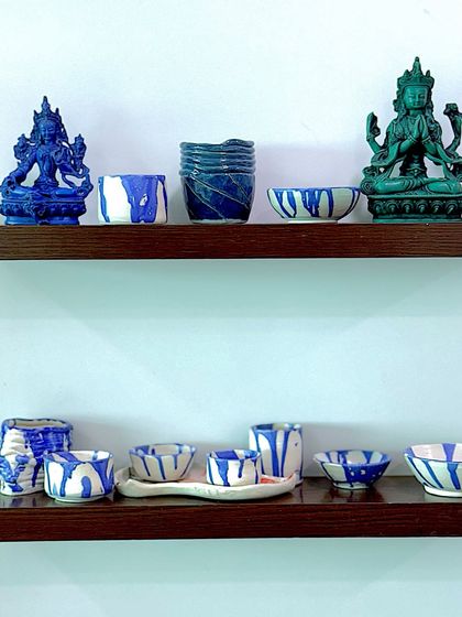 My new ceramic pieces, finding their place on the shelf next to other art that inspires me. The blue and white glaze patterns were a joy to experiment with.