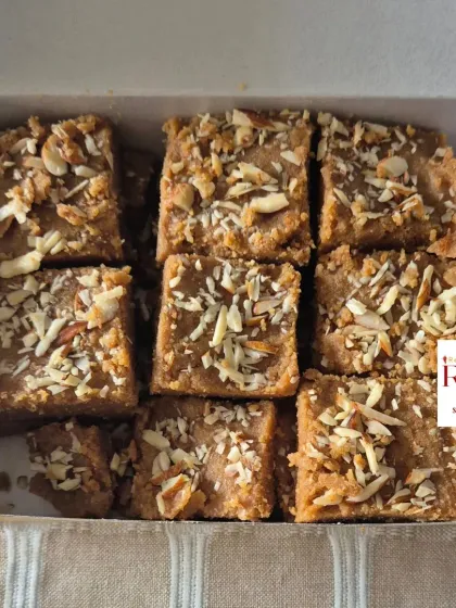 A close-up of my Gur Padi, also known as Sukhdi. This traditional Gujarati sweet is made with whole wheat flour, pure ghee, and jaggery, giving it a unique crispy yet melt-in-your-mouth texture, topped with sliced almonds.