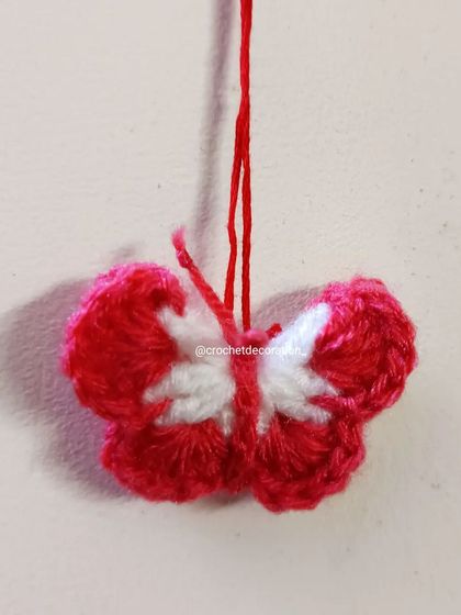 A delicate two-tone butterfly, perfect as a phone charm or a tiny decorative applique. This one is shown in red and white, but we can customize the colors for you.