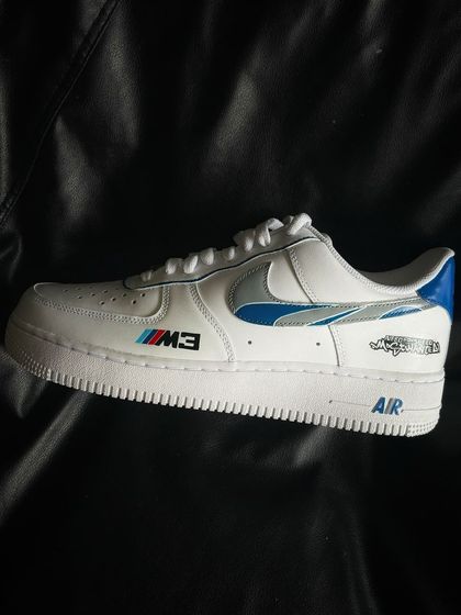 A side profile of the NFS Most Wanted custom sneaker, showing the iconic blue and silver livery.