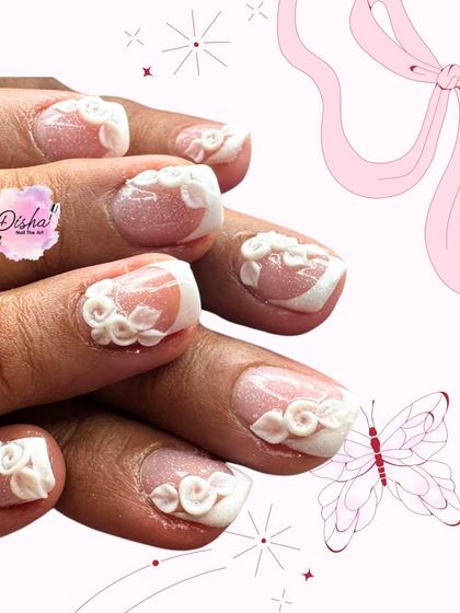 Taking the French manicure to the next level. This design features classic tips but adds beautiful, hand-sculpted 3D roses for a romantic and textured finish.