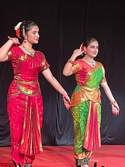 A graceful pose with my students. The matching costumes and synchronized movements create a visually stunning effect on stage.