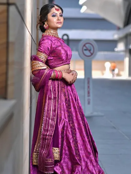 A vibrant magenta bridal lehenga paired with complementary makeup. My course will teach you how to work with a full spectrum of colors for bridal wear.